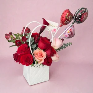 Side view of Valentine rose box with red and pink roses and heart balloons
