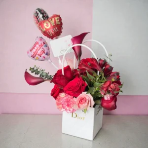 Crimson and blush rose arrangement in white gift box with Valentine balloons
