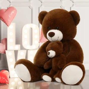 Giant brown plush teddy bear with baby teddy and love themed decor