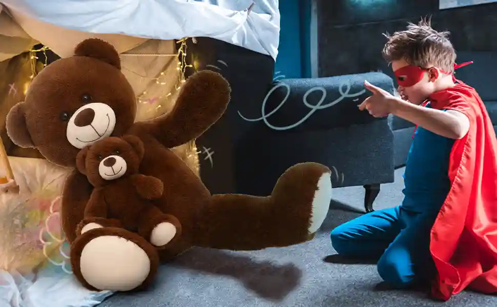 Child playing superhero next to giant plush teddy bear with baby teddy