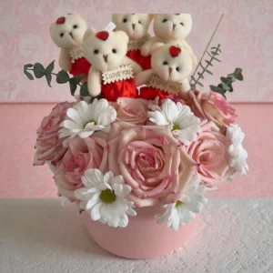 Pink rose flower box with teddy bears holding I love you signs and white daisies