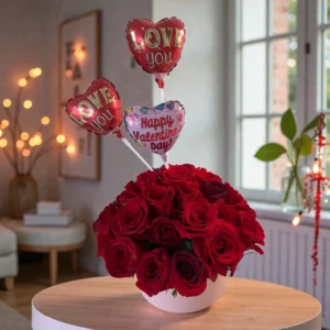 Ruby Romance Valentine rose box with red roses and love balloons indoors