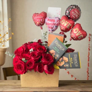 Front view of red rose Valentine box with chocolates and balloons
